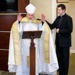 Bishop Roger J. Foys, Bishop of the Diocese of Covington, Kentucky, and Fr. Daniel J. Schomaker, Vicar General, bless the new community center.