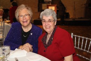 Sister Diana Lynn Eckel, left, Director of Mission Integration at St. Clare Commons in Perrysburg, Ohio, and Sister Nancy Ferguson, Director of Mission Integration at Trinity Health System in Steubenville, Ohio, enjoy the Gala activities.