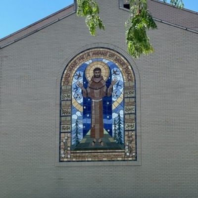 Located on the east die of the FCC, this 6 ft. wide and 29 ft. high center panel depicts Our Lady of Lourdes by Sister Agneta. C1981
